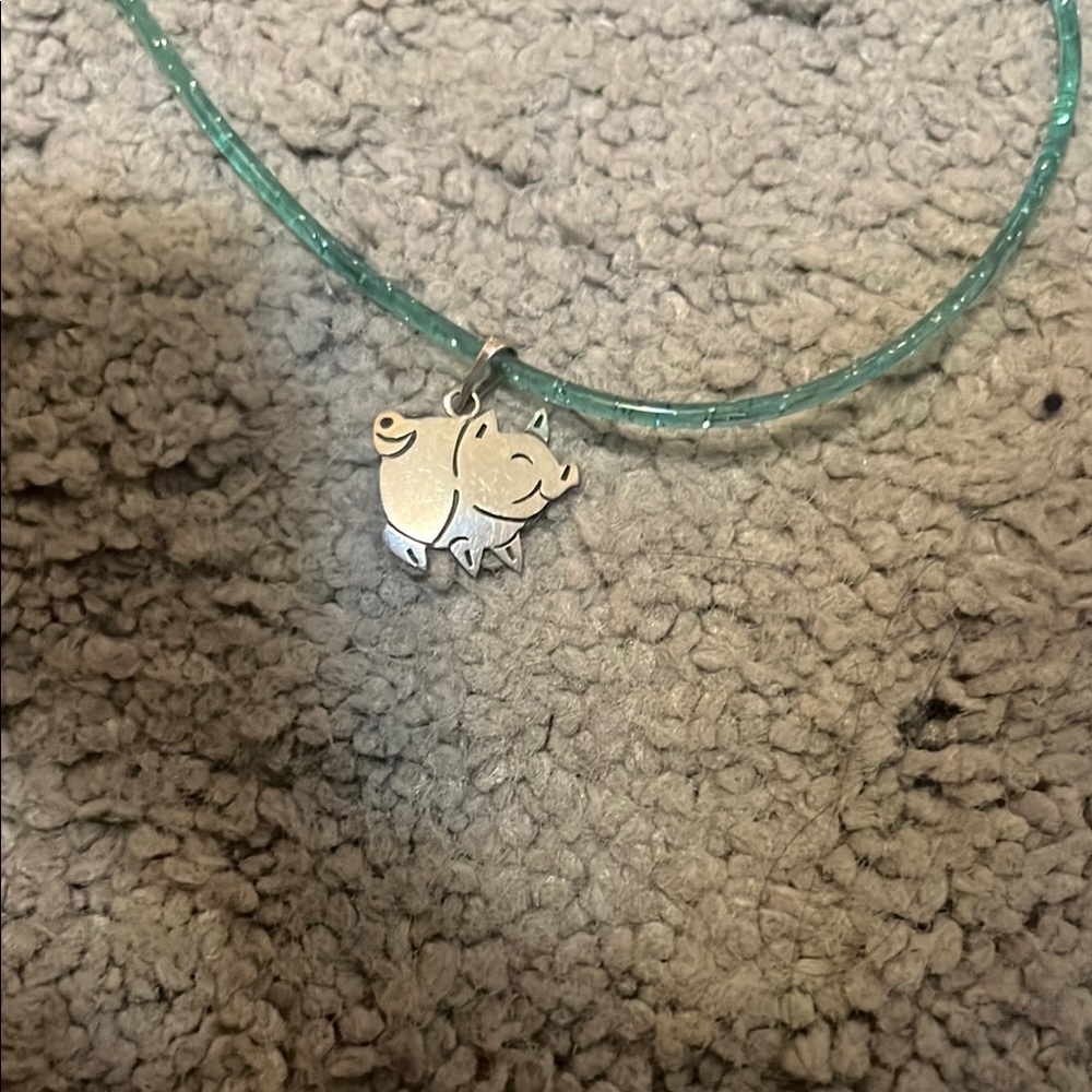 Blue chain and pig pendant